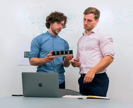 Two Men Discussing Robotics