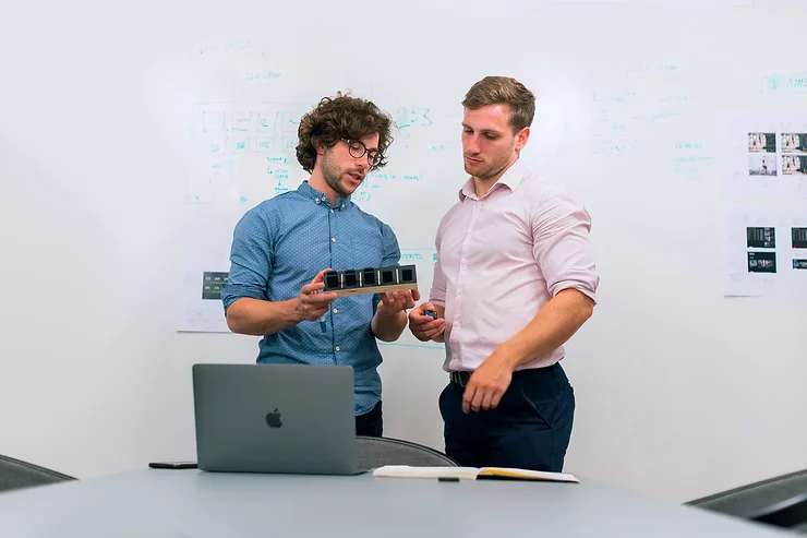 Two Men Discussing Robotics