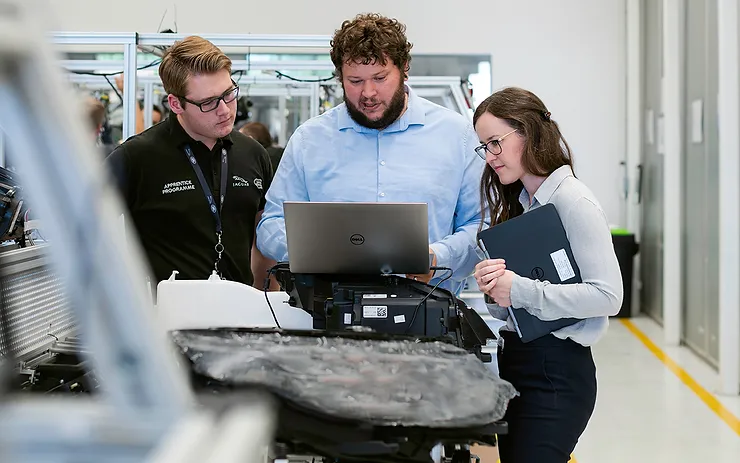 3 Engineers looking at computer