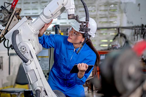 Woman Inspecting Robot