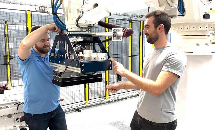 Two Men Working on a Robot